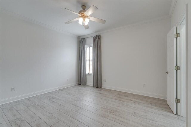 spare room with crown molding, light hardwood / wood-style flooring, and ceiling fan