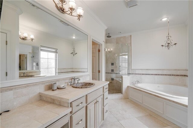 bathroom featuring plus walk in shower, oversized vanity, tile floors, and crown molding