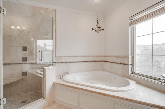 bathroom featuring a healthy amount of sunlight, tile flooring, ornamental molding, and separate shower and tub