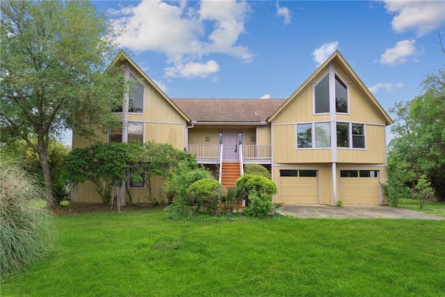 view of front facade with a garage and a front lawn