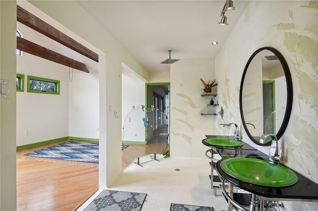 interior space featuring hardwood / wood-style floors and track lighting