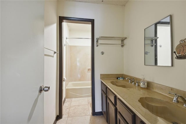 bathroom with tile floors, bathtub / shower combination, double sink, and large vanity