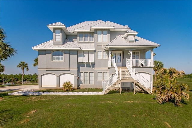 view of front of home featuring a front lawn and a garage