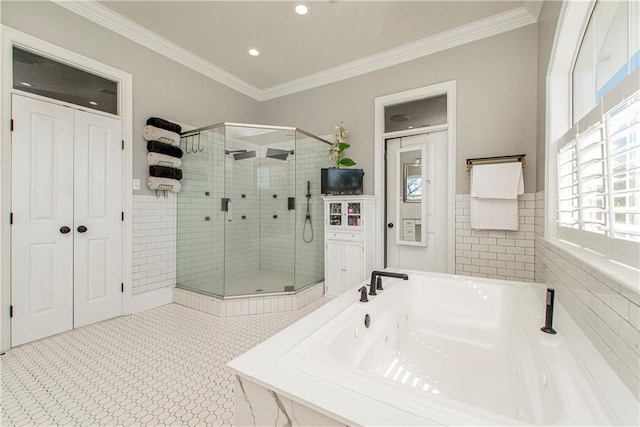 bathroom with tile walls, crown molding, tile flooring, and plus walk in shower