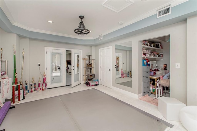 interior space featuring ornamental molding, french doors, and light tile flooring