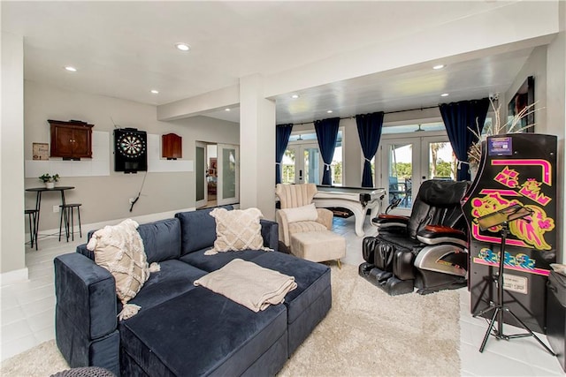 living room featuring french doors and light tile flooring