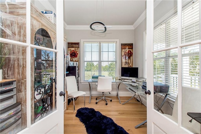 office area with ornamental molding and light wood-type flooring