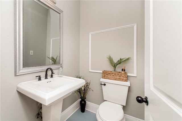 bathroom featuring sink and toilet