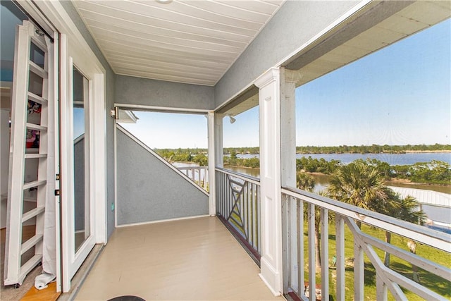 balcony featuring a water view