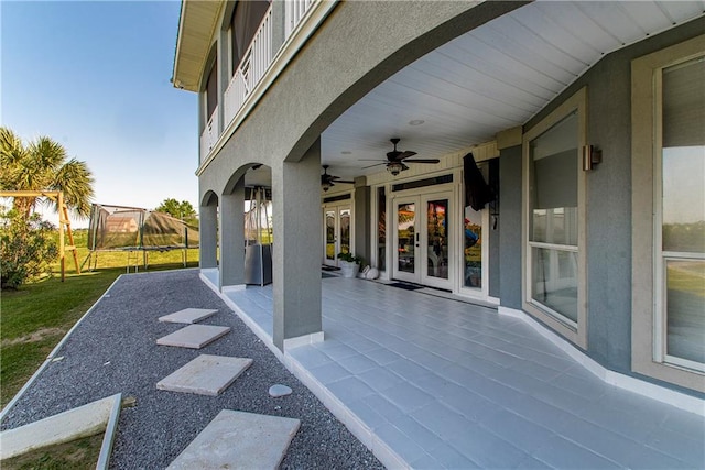 view of patio / terrace with french doors and ceiling fan