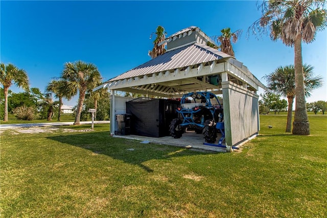 view of shed / structure featuring a carport and a yard