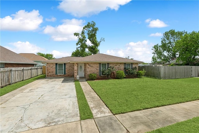 single story home featuring a front lawn