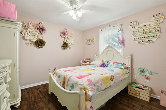 bedroom with ceiling fan and dark hardwood / wood-style floors