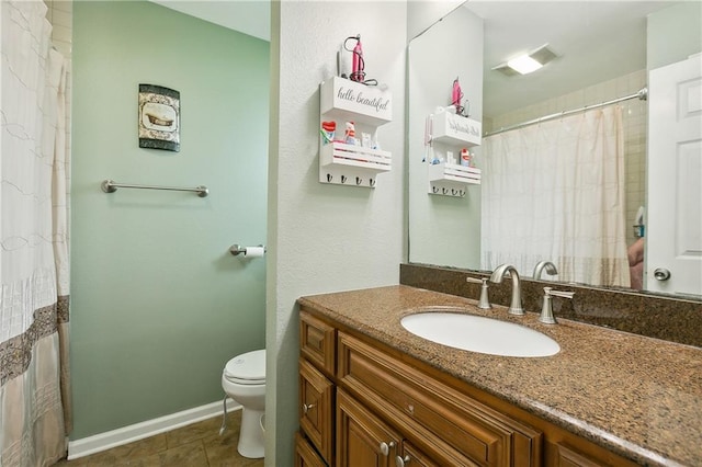 bathroom with tile patterned floors, a shower with shower curtain, toilet, and vanity