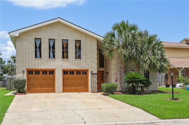 view of front facade featuring a garage and a front lawn