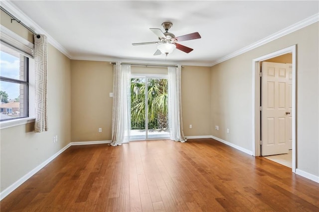 spare room with ornamental molding, hardwood / wood-style floors, and ceiling fan