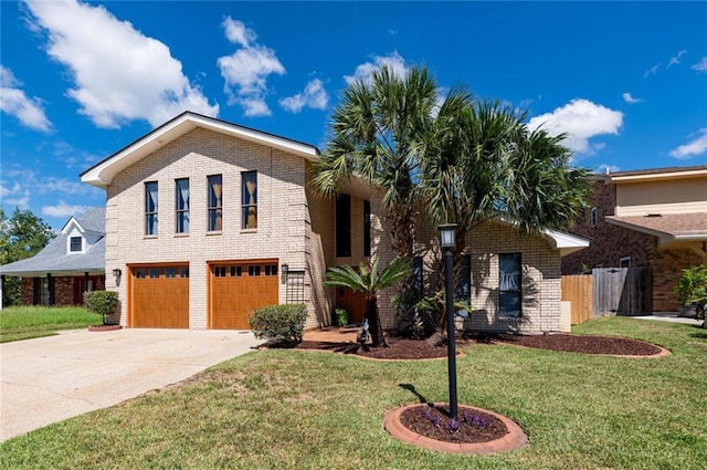 view of front of home with a garage and a front lawn