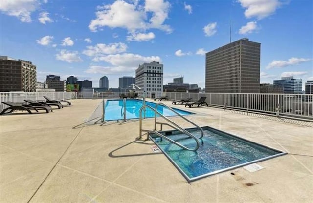 view of pool featuring a patio area