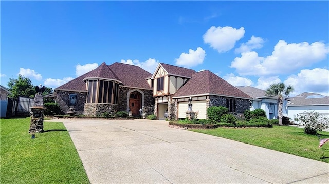 view of front of home featuring a front lawn and a garage