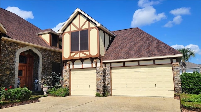 tudor-style house with a garage