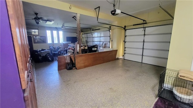 garage with ceiling fan and a garage door opener