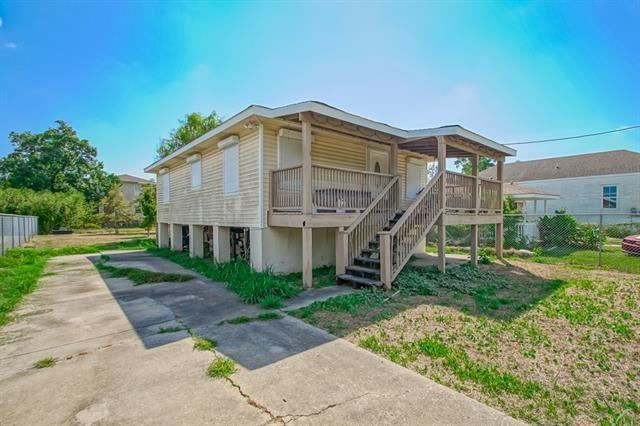 view of side of property with a wooden deck