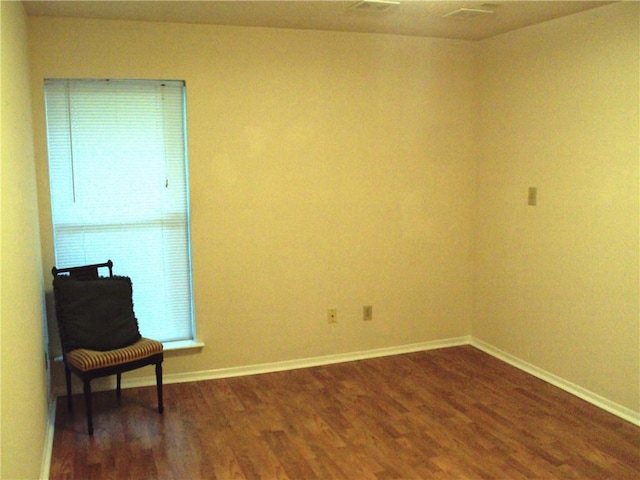 unfurnished room featuring dark wood-type flooring