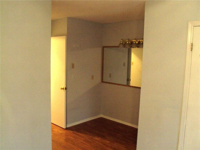 hall with hardwood / wood-style flooring