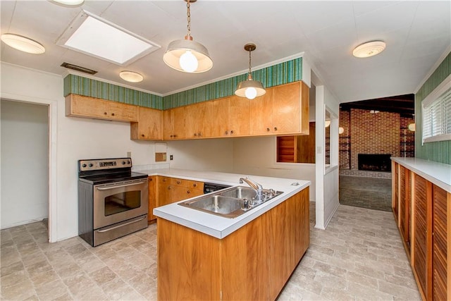 kitchen with hanging light fixtures, a fireplace, brick wall, sink, and stainless steel range with electric cooktop