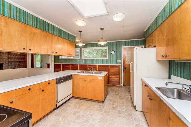 kitchen with decorative light fixtures, white appliances, a skylight, sink, and light tile floors