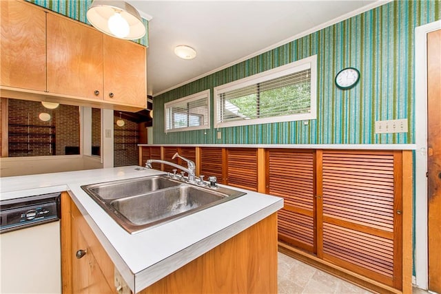 kitchen with kitchen peninsula, crown molding, white dishwasher, sink, and light tile floors