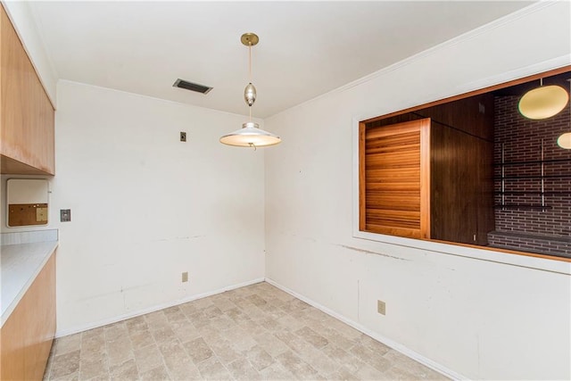 unfurnished room featuring light tile flooring