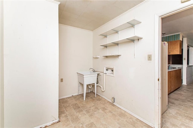 laundry area with washer hookup and light tile floors