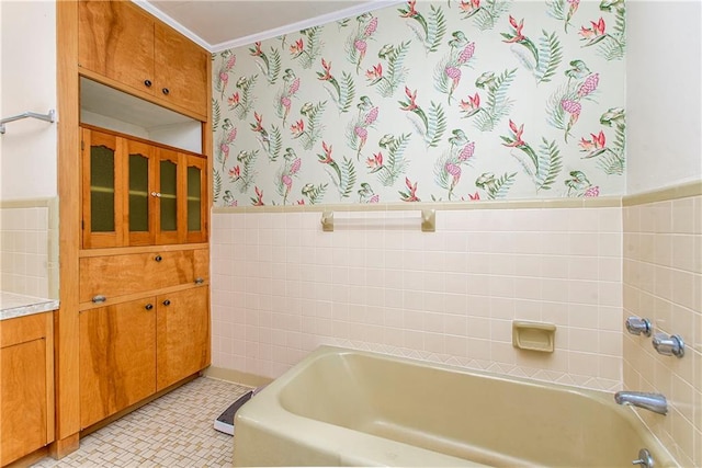 bathroom with crown molding, shower / tub combination, tile floors, and tile walls