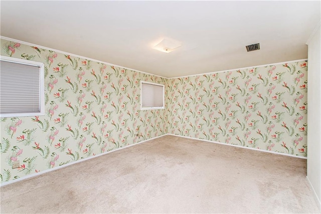 unfurnished room with light colored carpet