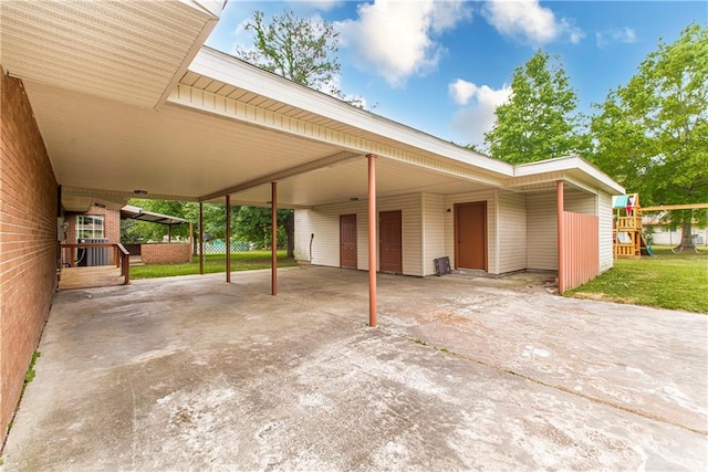 exterior space featuring a carport and a front lawn