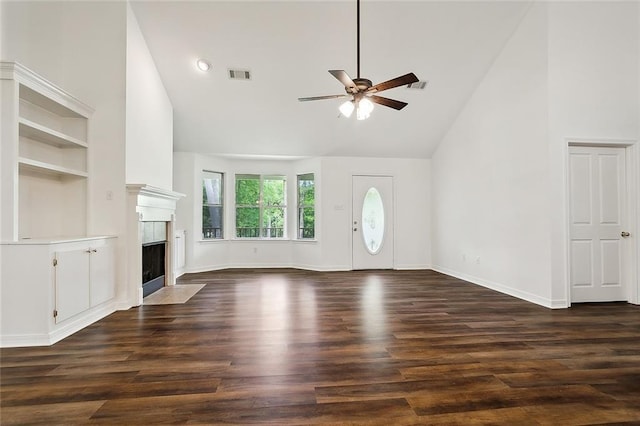 unfurnished living room featuring ceiling fan, high vaulted ceiling, and dark wood-type flooring