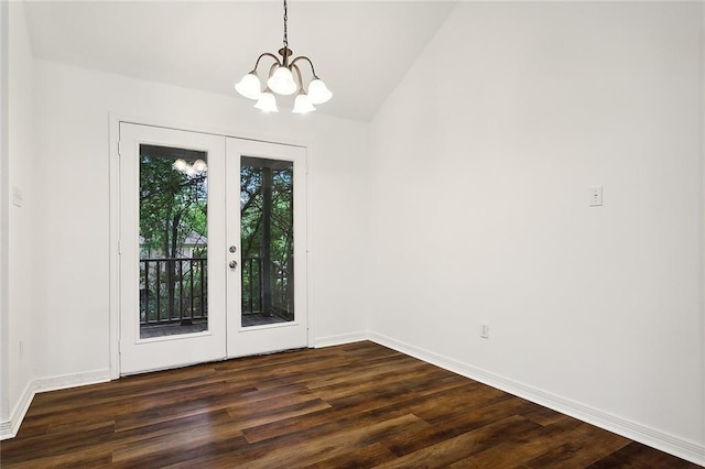 interior space featuring a chandelier, french doors, dark hardwood / wood-style flooring, and lofted ceiling