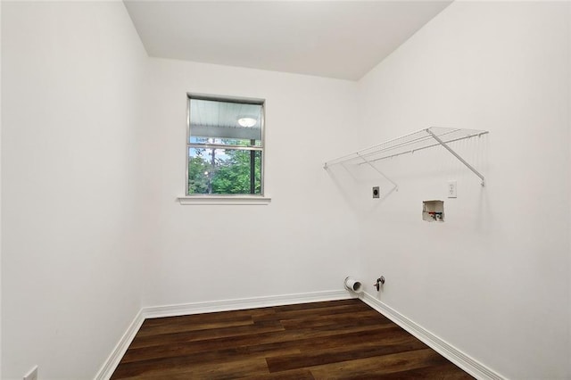 clothes washing area with gas dryer hookup, washer hookup, dark hardwood / wood-style floors, and hookup for an electric dryer