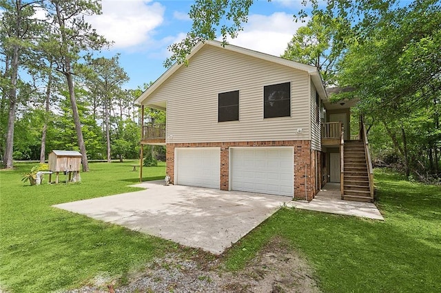 exterior space with a garage, a yard, and a deck