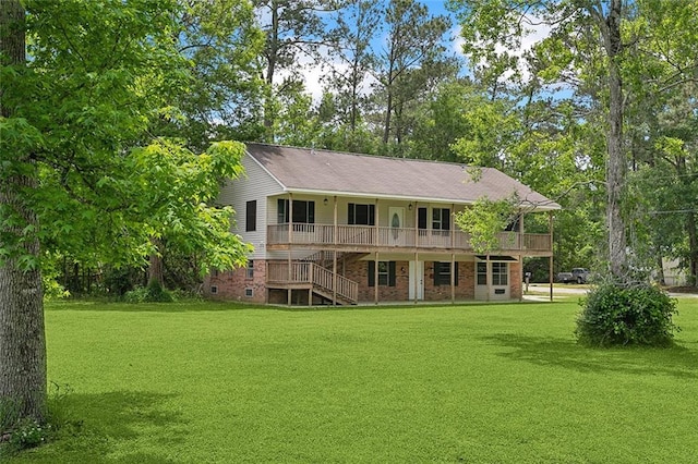 rear view of property with a lawn