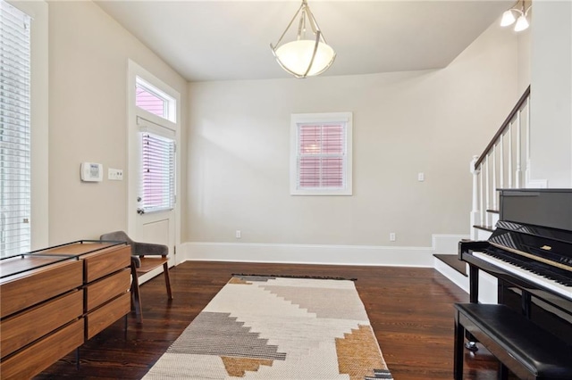 sitting room with dark hardwood / wood-style flooring