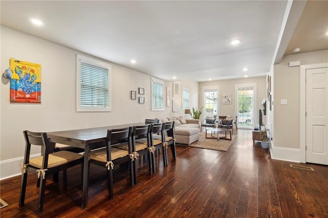 dining space featuring dark hardwood / wood-style flooring