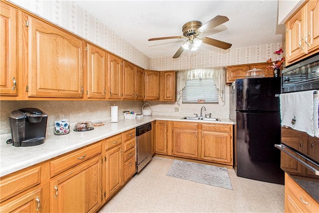 kitchen featuring black refrigerator, sink, stainless steel dishwasher, light tile floors, and ceiling fan