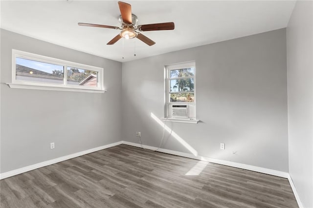 unfurnished room featuring ceiling fan and dark hardwood / wood-style flooring