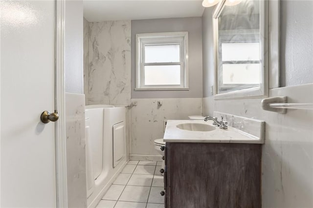 bathroom with vanity, toilet, and tile patterned flooring