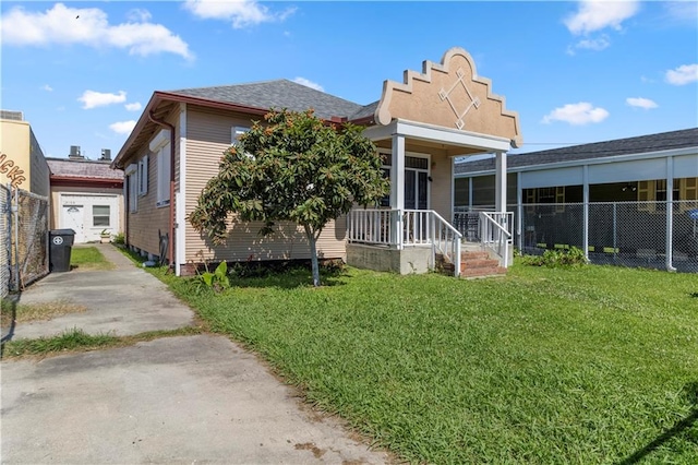 back of property featuring a lawn