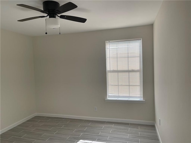 empty room featuring wood-type flooring and ceiling fan