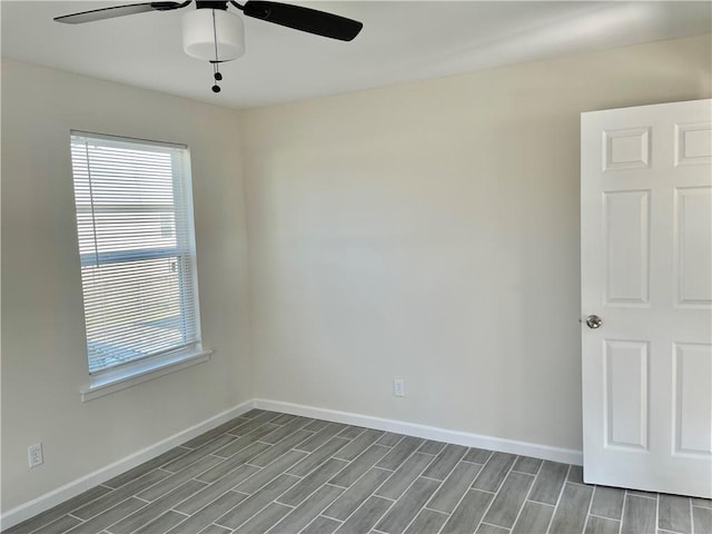 empty room featuring wood-type flooring and ceiling fan