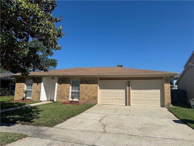 single story home with a garage and a front yard